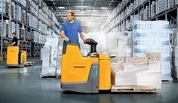 Man Operating a Loaded ERE 125/225 Powered pallet Truck